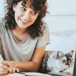 A woman with a cat learning energy healing for cats