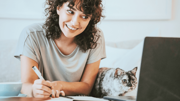 A woman with a cat learning energy healing for cats